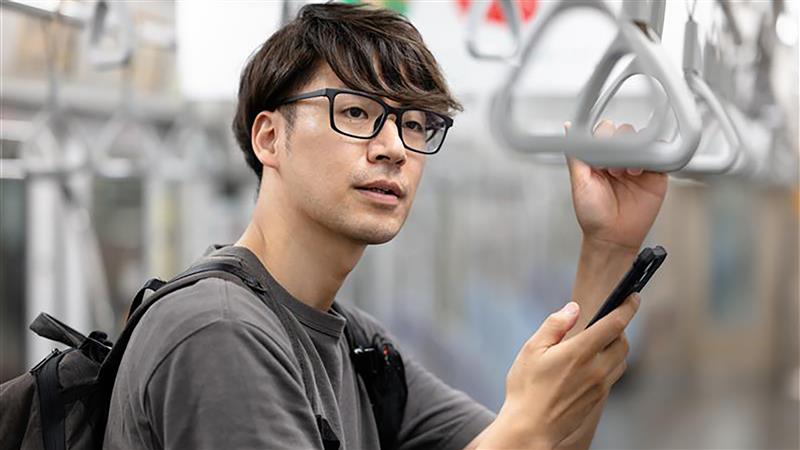 man-on-train-contemplating